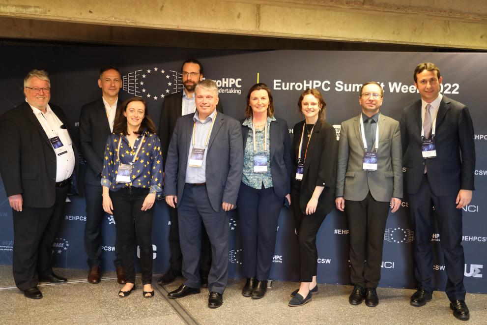 Group picture of the EuroHPC JU Staff with Herbert Zeisel, the Chair and Anders Dam Jensen the Executive Director