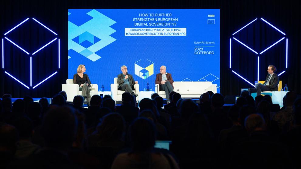 An image of 4 people on stage at the EuroHPC 2023